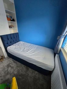 single bed with matress and backboard