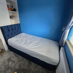 single bed with matress and backboard
