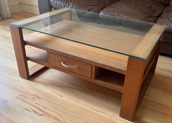 Coffee table - glass topped with shelves and 1 drawer (open to offers)