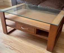 Coffee table - glass topped with shelves and 1 drawer (open to offers)