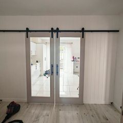 sliding doors with rail same as new..need gone as moving this weekend