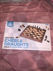 Boxed wooden chess board, prices and checkers set