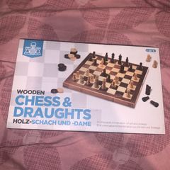 Boxed wooden chess board, prices and checkers set