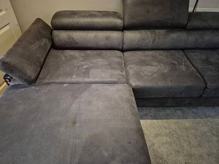 dark grey corner sofa with sleeping and storage