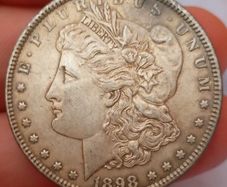 one dollar coin  silver. Silver.   Heavy