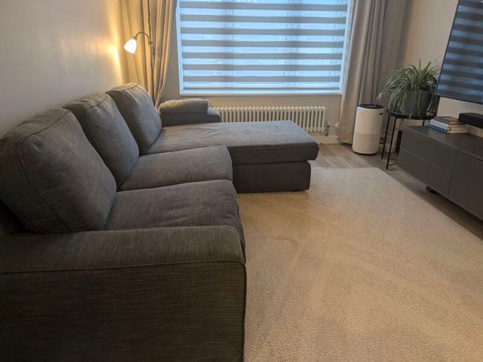 IKEA KIVIK 3-seater sofa with chaise in dark grey.