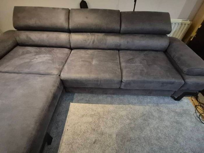 dark grey corner sofa with sleeping and storage