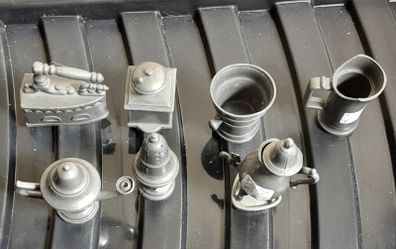 selection of seven pewter ornaments