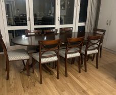 Extendable mahogany dining table and 8 Reprodux chairs