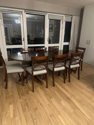 Extendable mahogany dining table and 8 Reprodux chairs