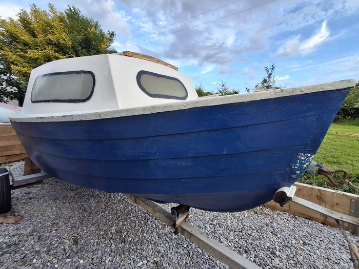 Small boat with engine and trailer