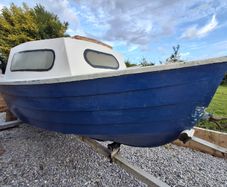 Small boat with engine and trailer