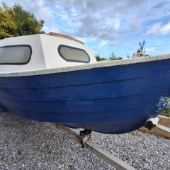 Small boat with engine and trailer