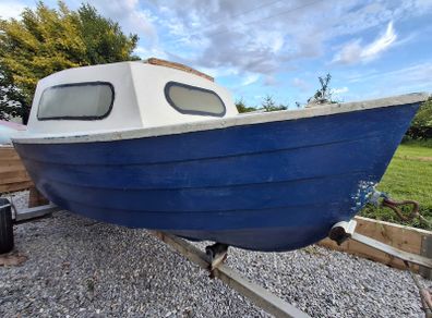 Small boat with engine and trailer