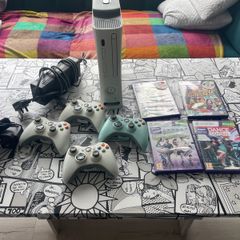 Xbox 360 plus Kinect and 4 pads and games