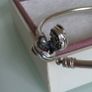 Pandora Moments encircled clasp bangle openwork swirl clasp holding a sparkling center crystal in great condition Image 6