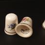 Collection of Flower Themed Gold Coloured Edged Thimbles Image 8