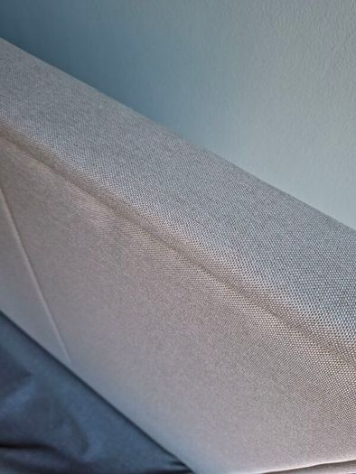 Standard double bed with cream headboard