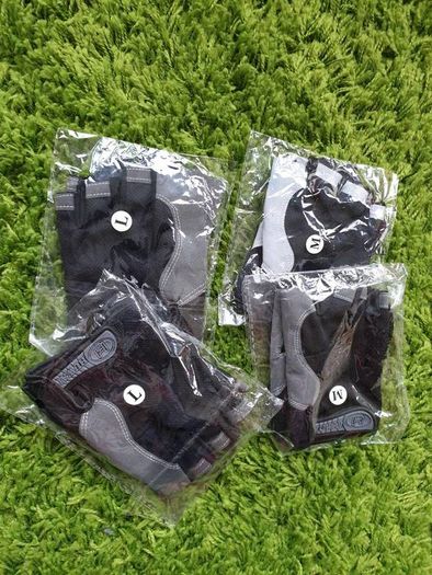 Gym gloves. Fingerless gloves. Cycling gloves. Work gloves. Carpenter gloves. Weightlifting. Workout.  Fitness.  Bodybuilding
