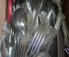 Box of spoons forks knifes