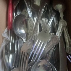 Box of spoons forks knifes