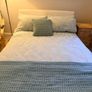 White faux leather 4ft 6in double bed frame, in as-new condition. Image 6