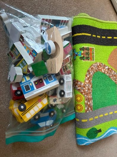 wooden toy town and rug