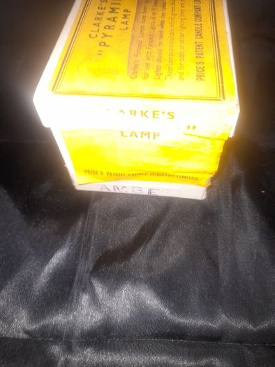 Clarkes Pyramid lamp night light and an Advertisment Box, comprising a white glazed ceramic reservoir marked Prices Patent Candle Company Limited, London