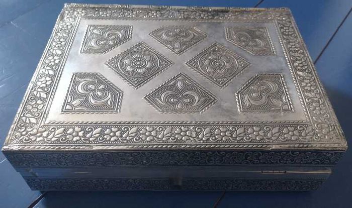 Book-shaped silver jewellery box with purple velvet lining