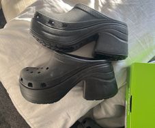 pair of black heeled crocs size 8