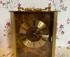 A vintage Staiger German quartz mantle clock. Height 5 inch 13cm. Width is 4 inch's 10cm