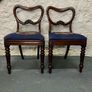 A pair of Victorian mahogany balloon back chairs with tapestry seats. Image 2