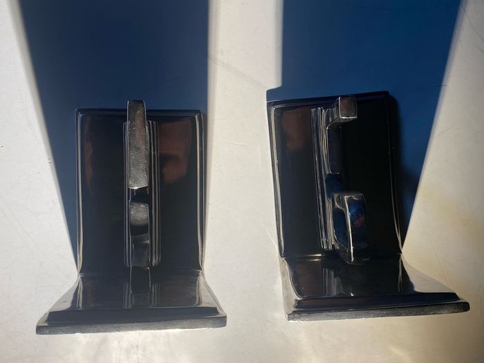 bookends made of cast metal likely aluminum that spell love
