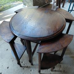 Vintage round nest of tables central round table four pie slice nesting tables tucked underneath