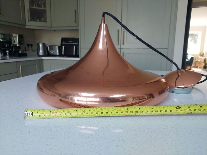 Copper pendant ceiling light. Lovely shape.
