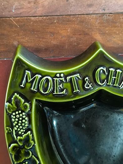 vintage Moet & Chandon shield-shaped ceramic advertising piece.