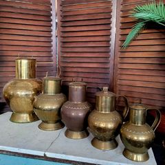 Antique brass & copper graduated collection of lidded dairy pitchers