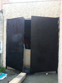 Garage door with double door. solid tick iron pan. has inlock and bolt locks. can be divided into two single doors and use separate with one door each. Size 7.5 x7.5 feet..