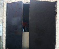 Garage door with double door. solid tick iron pan. has inlock and bolt locks. can be divided into two single doors and use separate with one door each. Size 7.5 x7.5 feet..