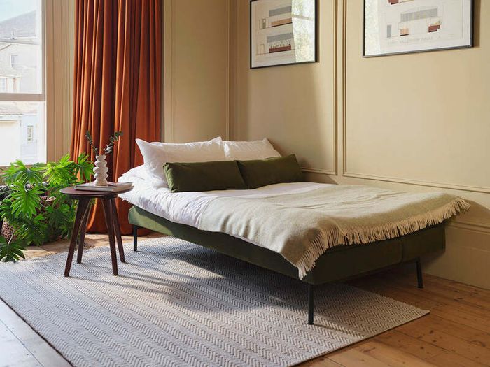 Vibrant green Swyft sofa bed couch with matching pillows (Colour not accurately reflected in own pictures, see listing for brands original pictures)