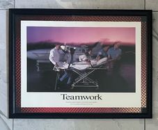 Framed Motivational Teamwork Photo showing ambulance crew/ hospital transporting patient with airplane in the rear