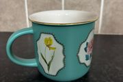 Brand Mew Mug with a Gold Rim and Floral Designs