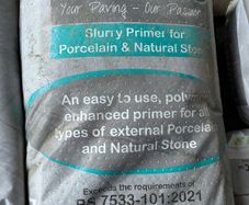 Primer for porcelain or natural stone