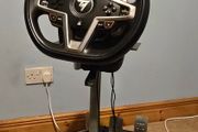Thrustmaster T248 Racing Wheel and T3PM Pedal Set, complete with a sturdy folding metal wheel stand.