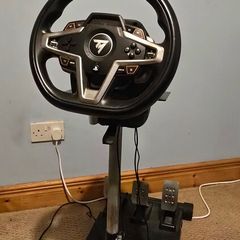 Thrustmaster T248 Racing Wheel and T3PM Pedal Set, complete with a sturdy folding metal wheel stand.