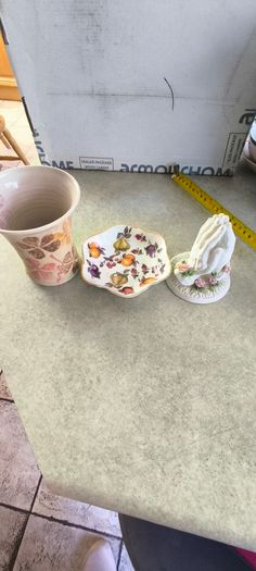 3 different itmes- 1- vintage small ceramic flared vase signed T. Casey 20 .00 euro. 2 - St. George Bone China Trinket small dish/ bowl England 12.00 euro. 3- Miniature Ceramic Praying Hands. 5 inches. White With Pink Flowers On The Base.12.00 euro.