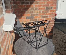 Carrier for bicycle with rear suspension