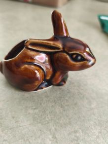 Brown rabbit majolica statue.
