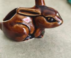 Brown rabbit majolica statue.