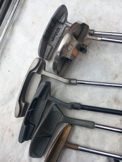 A selection of Golf clubs. Bags and golf balls.